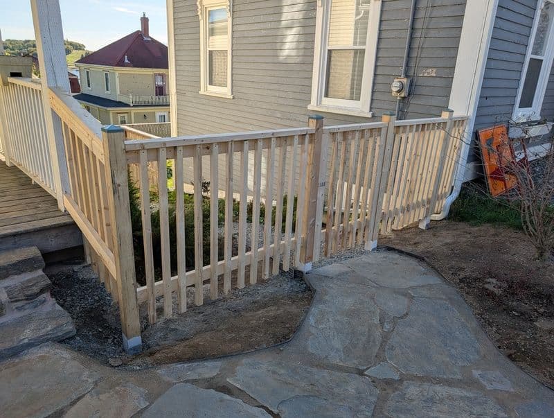 A new exterior, wooden, side railing